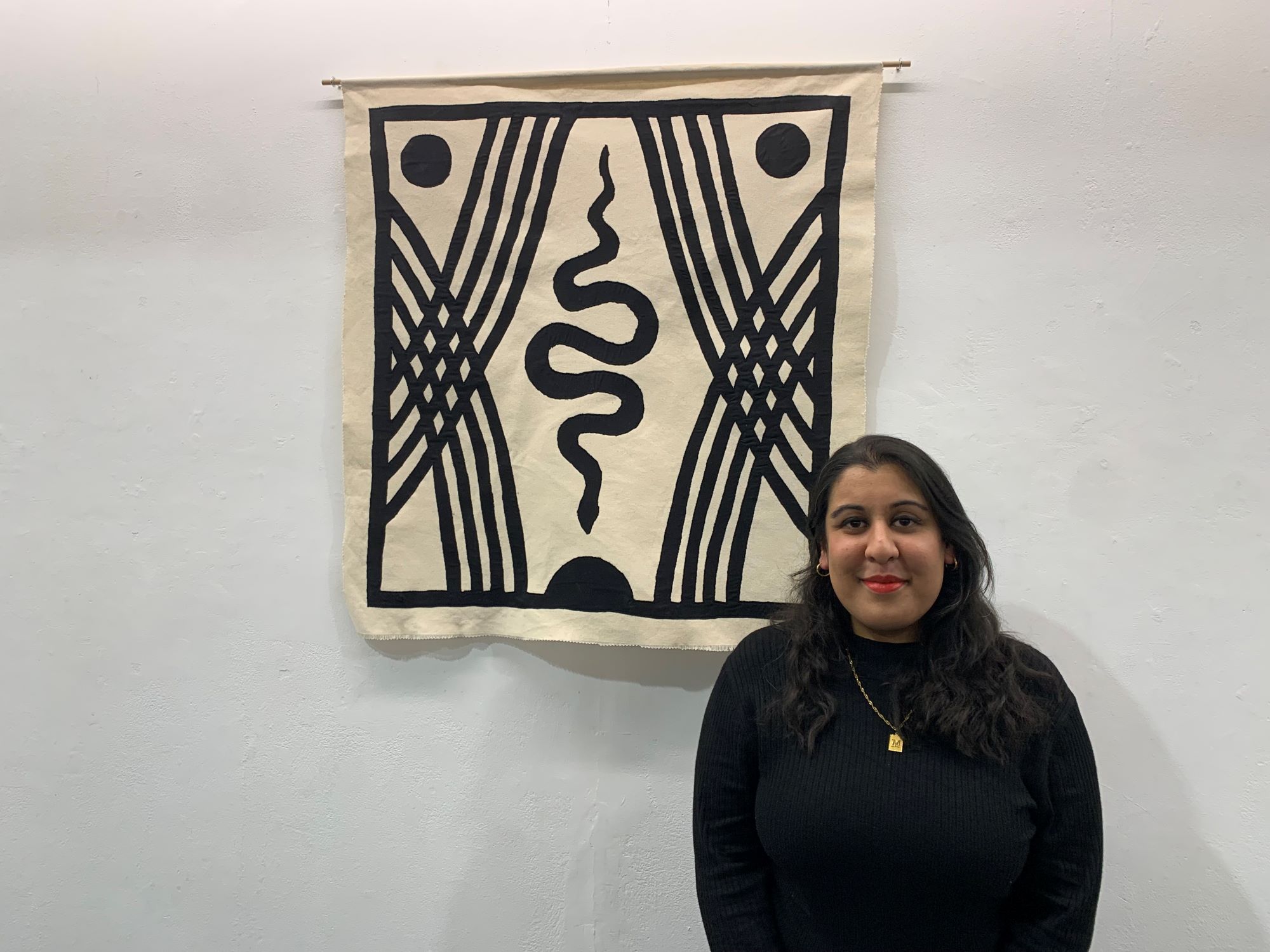 Mani Kambo with one of her Counterweight wall hangings
