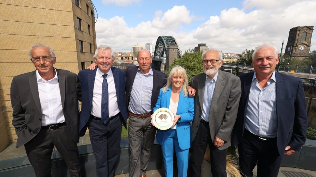 award winners receiving a plaque