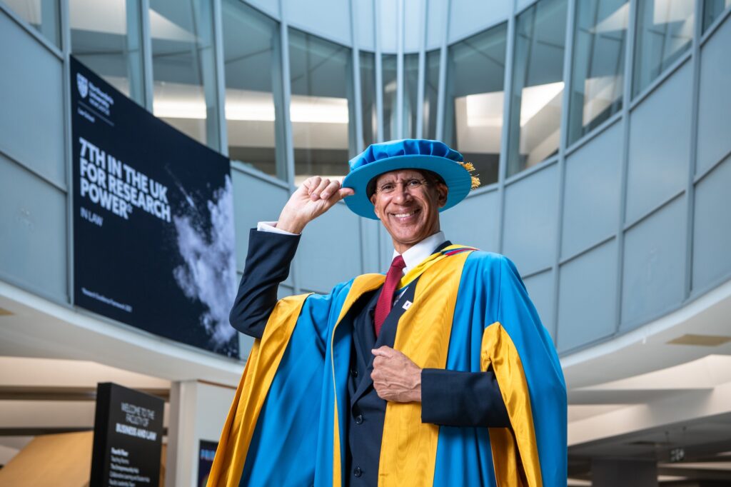 man wearing university gown